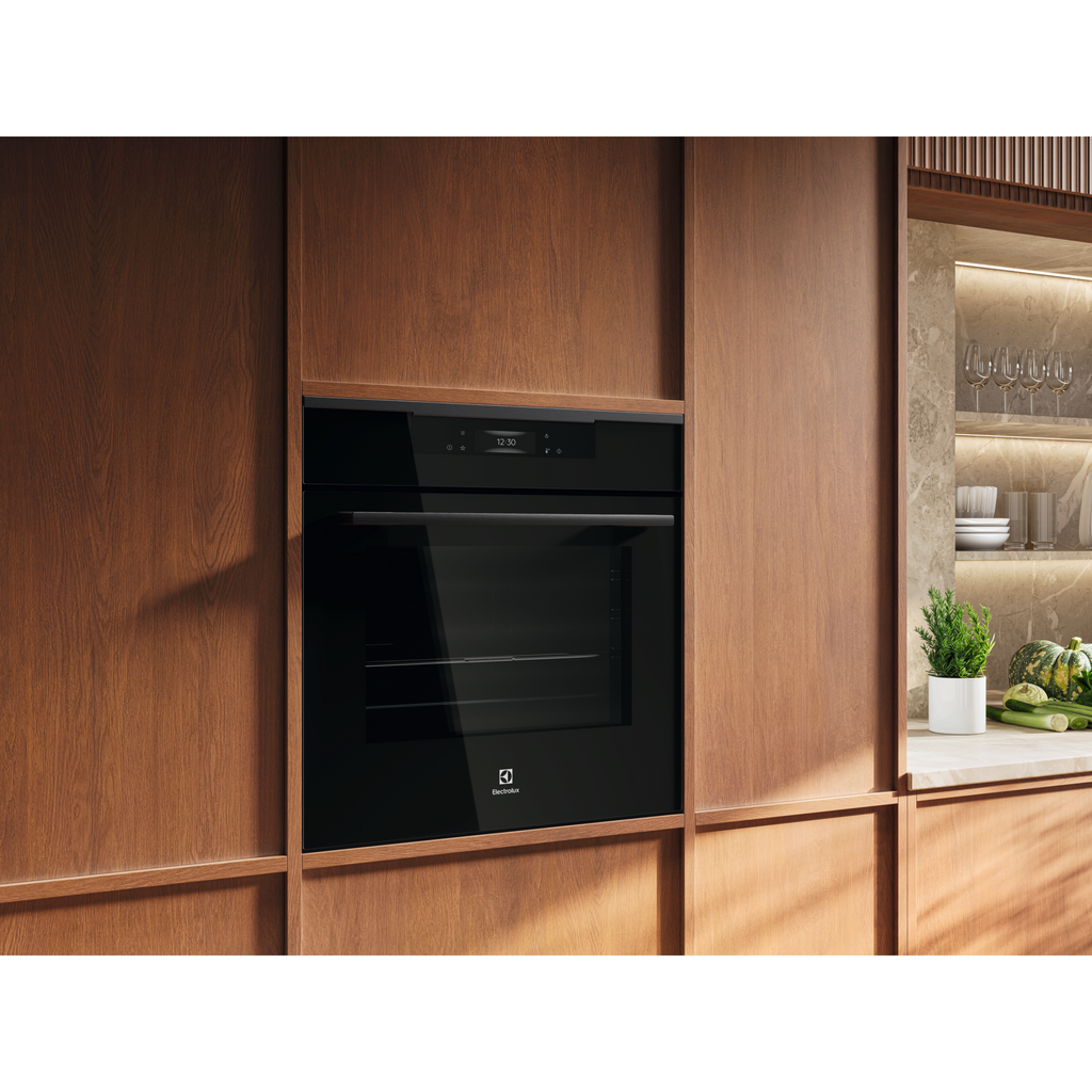 Electrolux KOFBC38H 60 cm 500 SurroundCook built-in single oven, 72 L, installed in a timber kitchen cabinet, angled room view