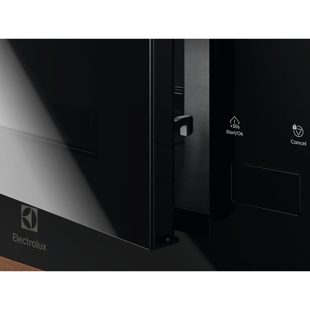 Electrolux EMFB25BG 600 Series built-in grill microwave oven, angled close-up of the door edge, catch and the Start and Cancel controls