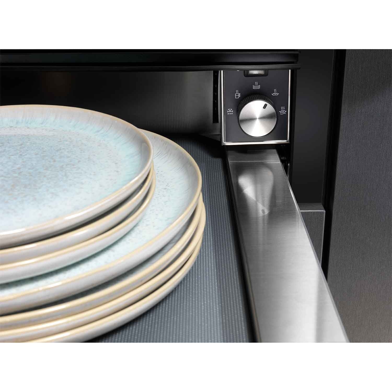 Electrolux KBD4X 60 cm UltimateTaste 700 built-in warming drawer, close-up of the stainless steel control knob with a stack of plates warming inside