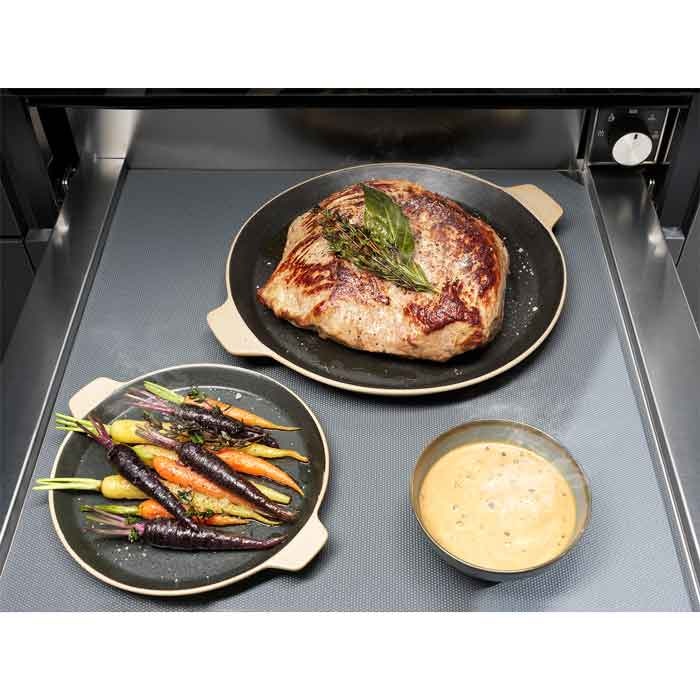 Electrolux KBD4X 60 cm UltimateTaste 700 built-in warming drawer, view down into the open drawer holding a seared beef joint, roasted carrots and a bowl of sauce