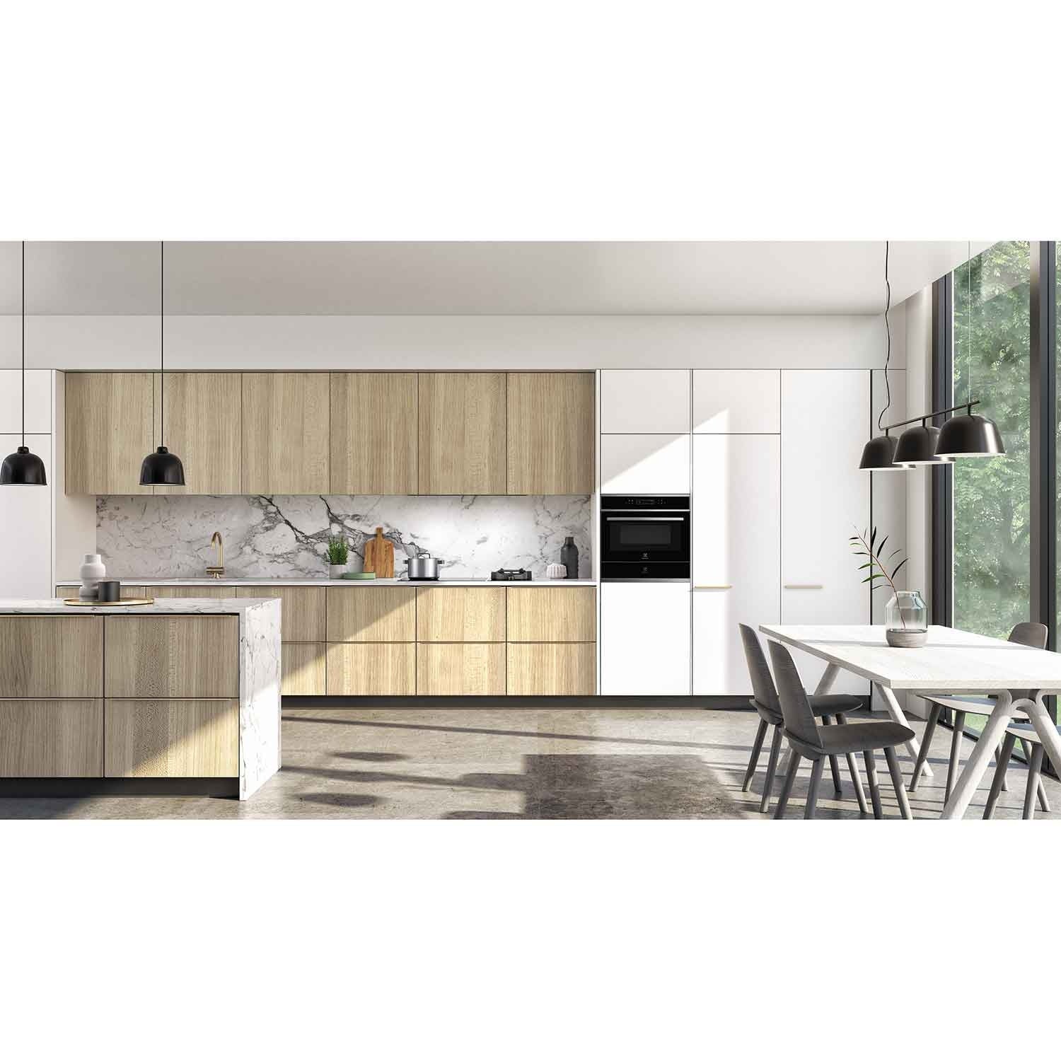 Electrolux KBD4X 60 cm UltimateTaste 700 built-in warming drawer, kitchen setting with a black Electrolux built-in appliance column in light timber and white cabinetry